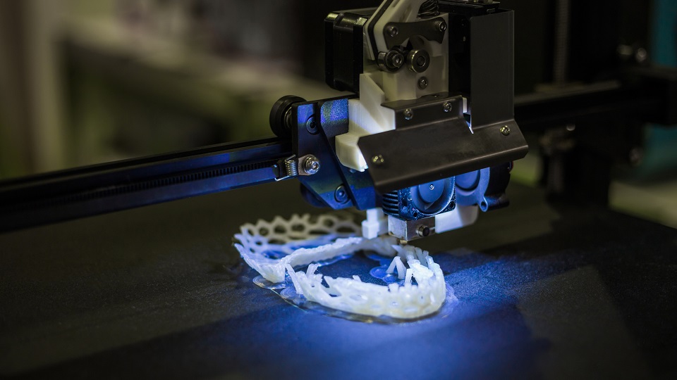 3D printer printing a model - progressive modern additive technology